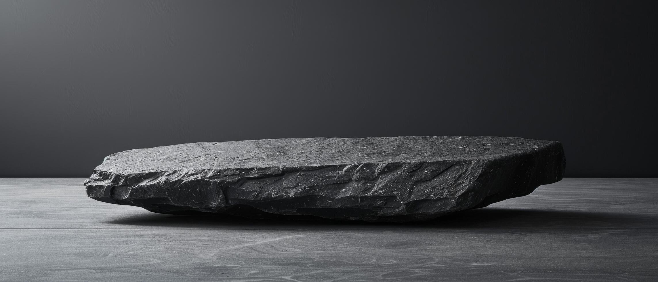 Slate Rock Display on Dark Background photo