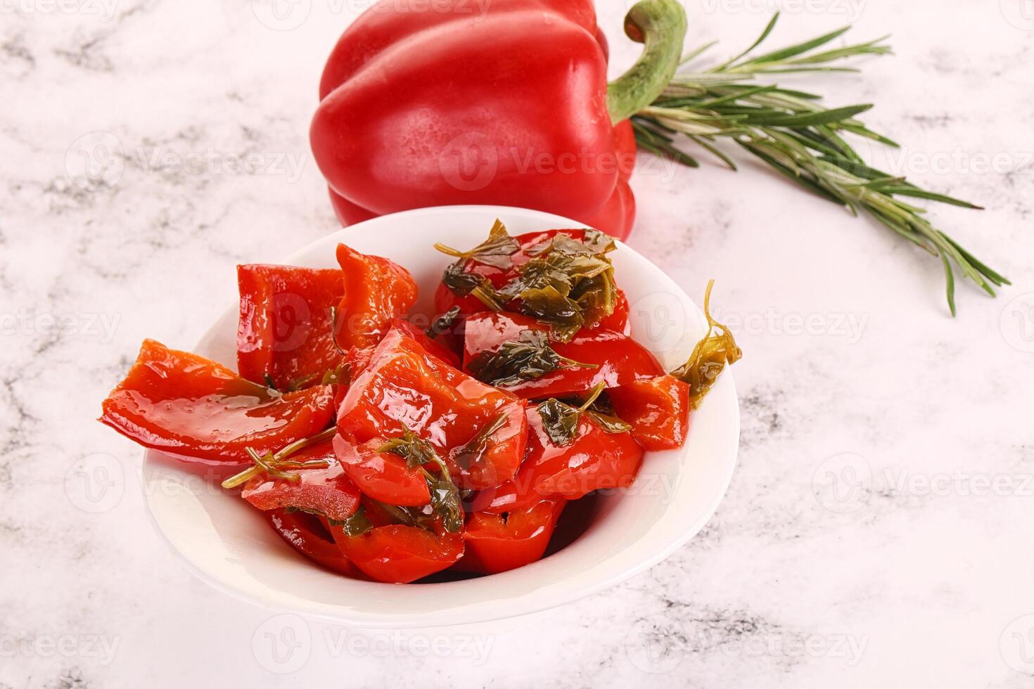 Pickled red bell pepper in the bowl photo