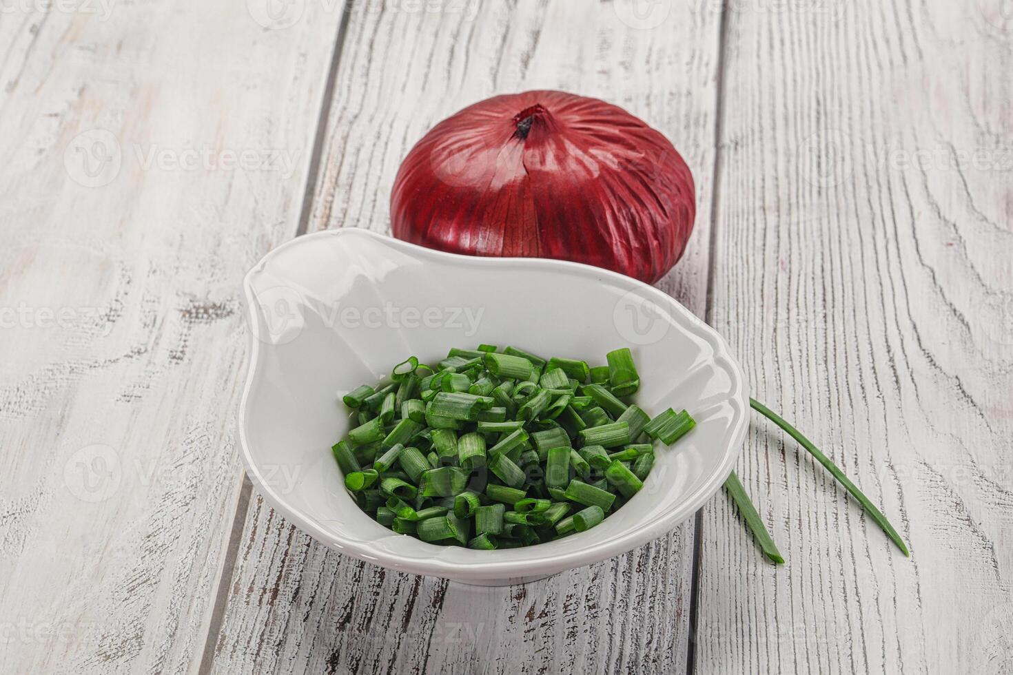 Diced green onion in the bowl photo