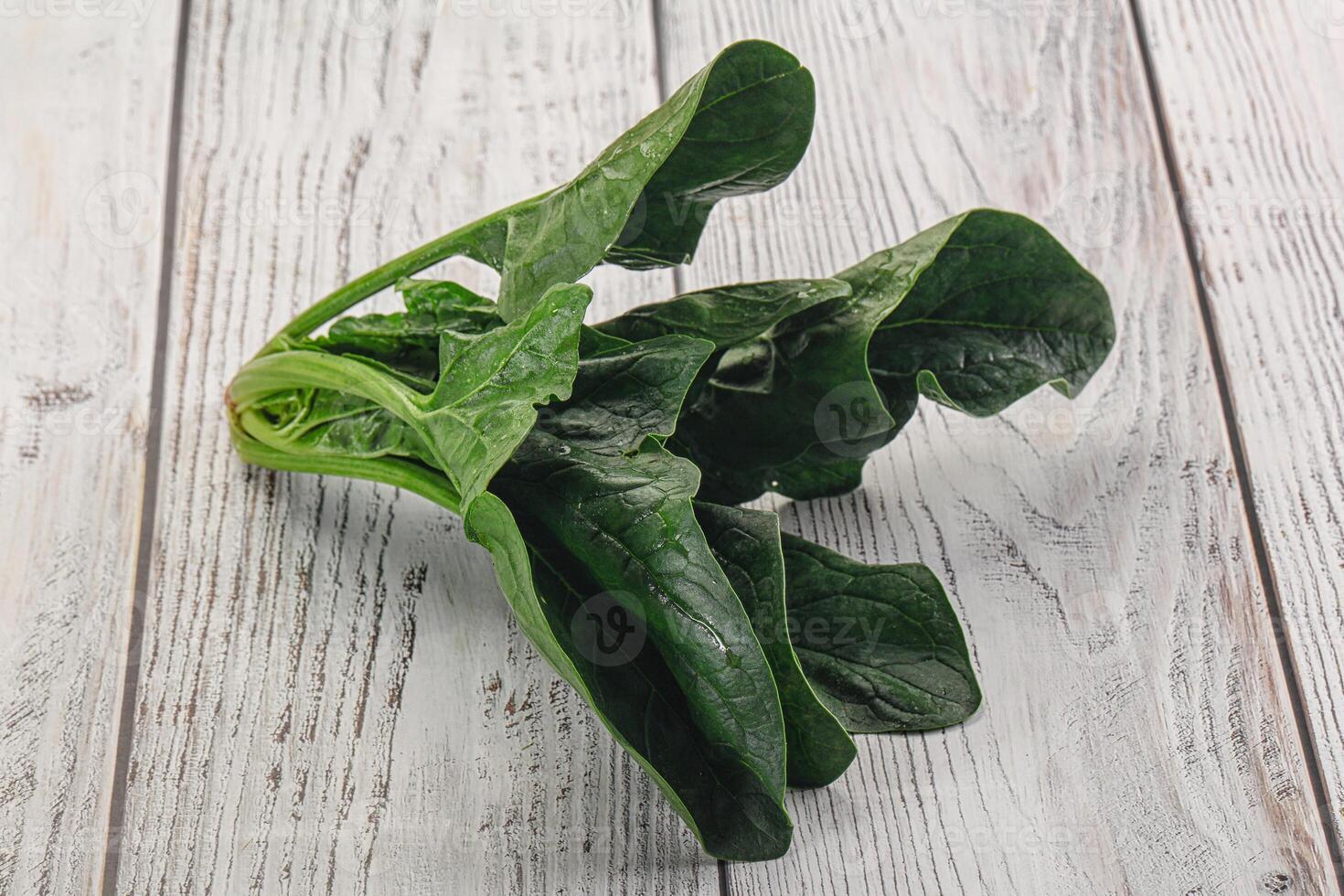 Ripe green spinach leaves heap photo
