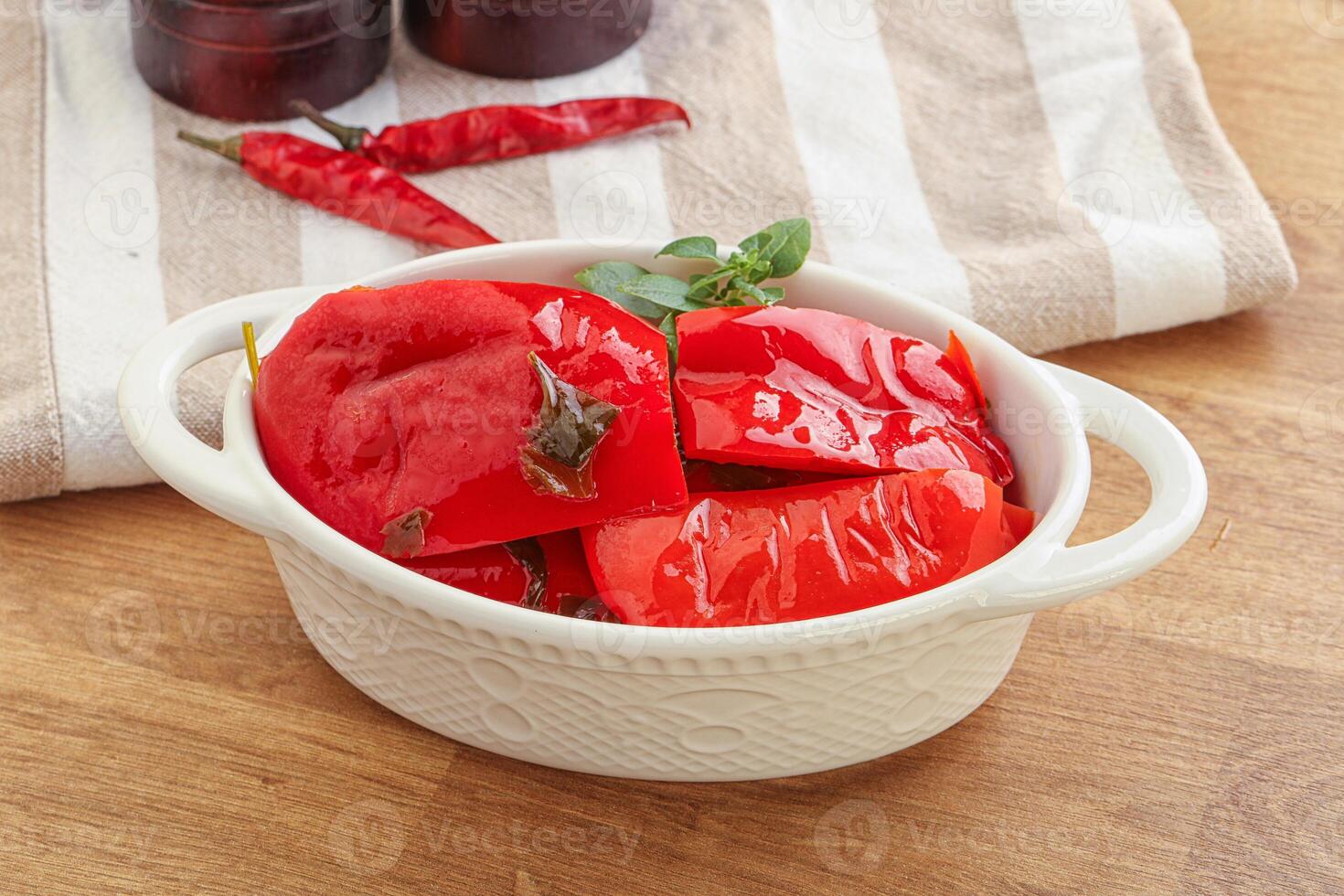 Marinated red bell pepper with oil photo