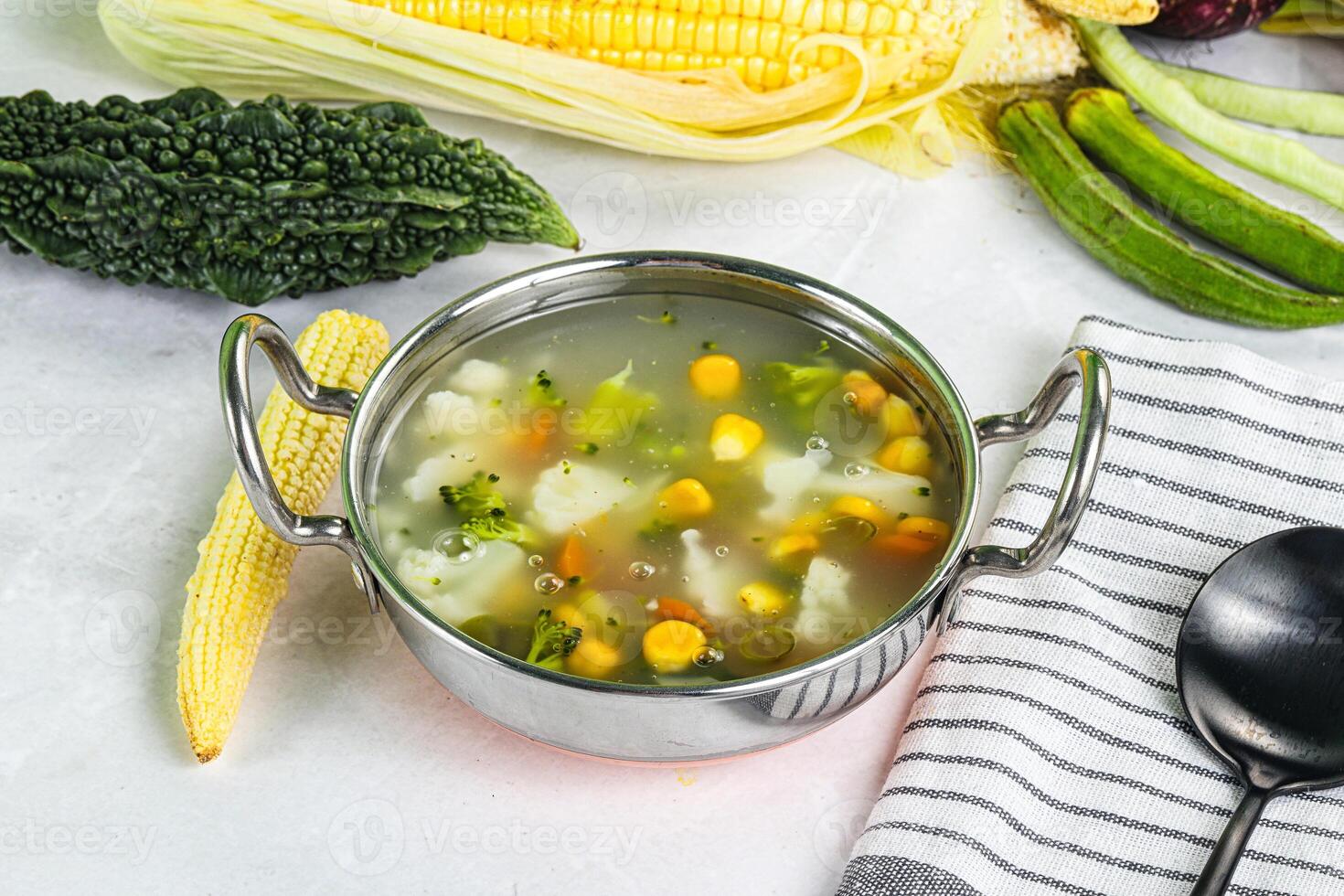 Soup with corn and broccoli photo