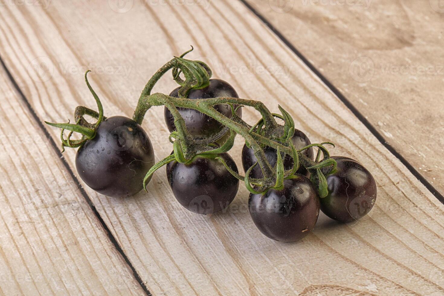 Ripe tasty black cherry tomato photo