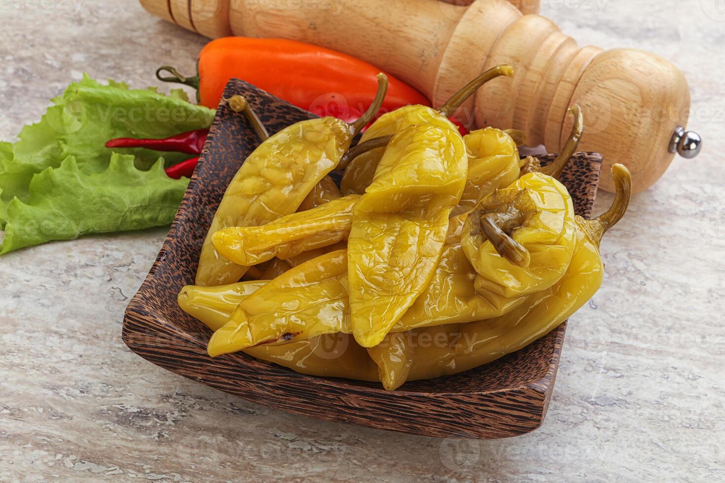Pickled marinated spicy green pepper photo