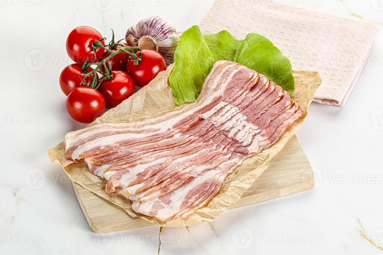 Sliced pork bacon oved board photo