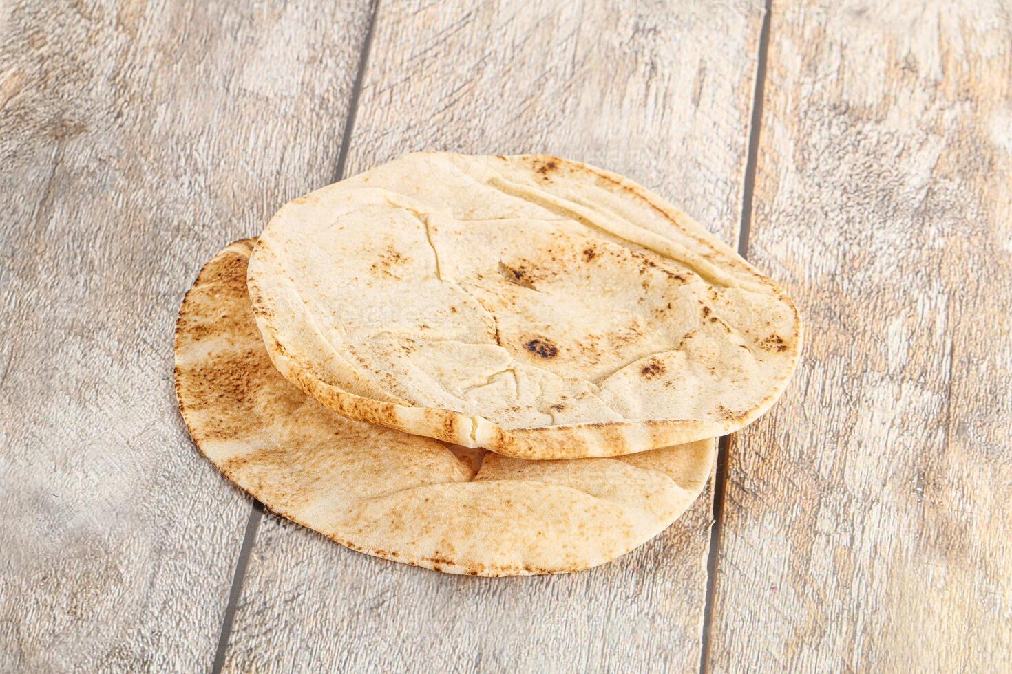 Traditional eastern round pita bread photo