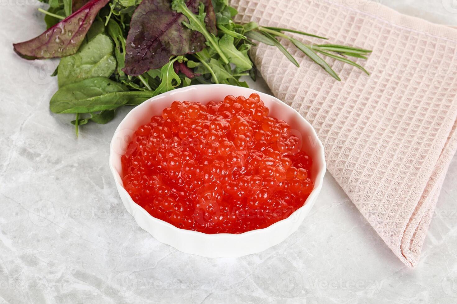 Red caviar in the bowl photo