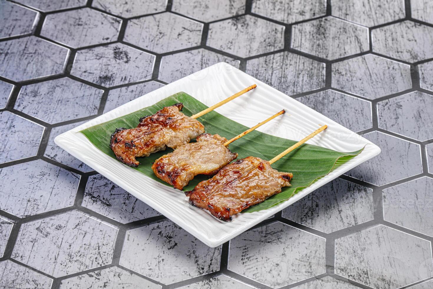 Thai cuisine - grilled pork skewer photo
