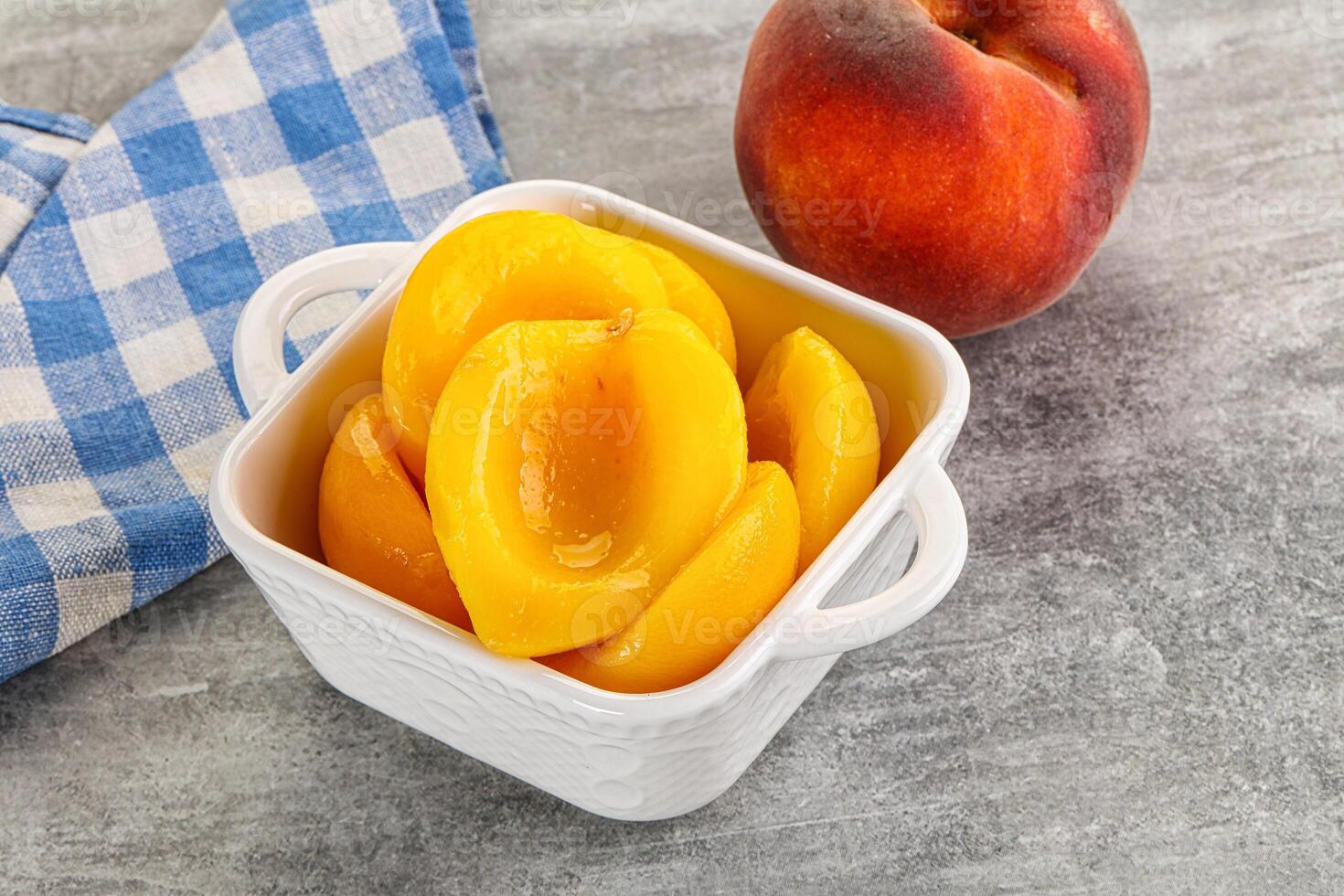 Ripe sweet and juicy canned peach photo