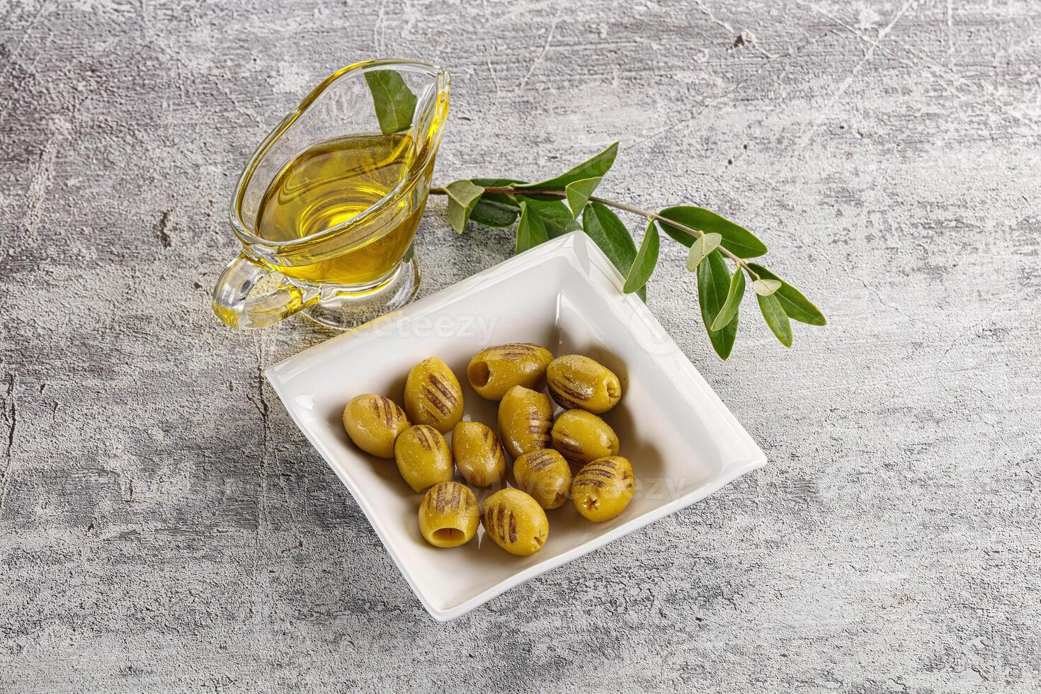 Grilled green olives appetizer snack photo