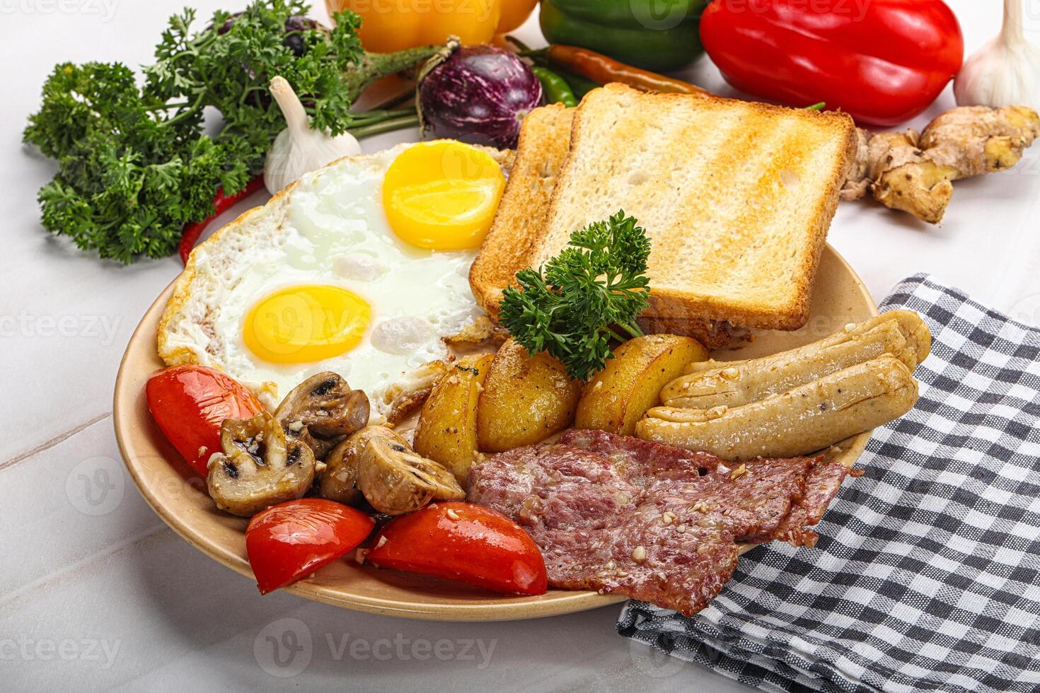 English breakfast with toast, egg and sausages photo