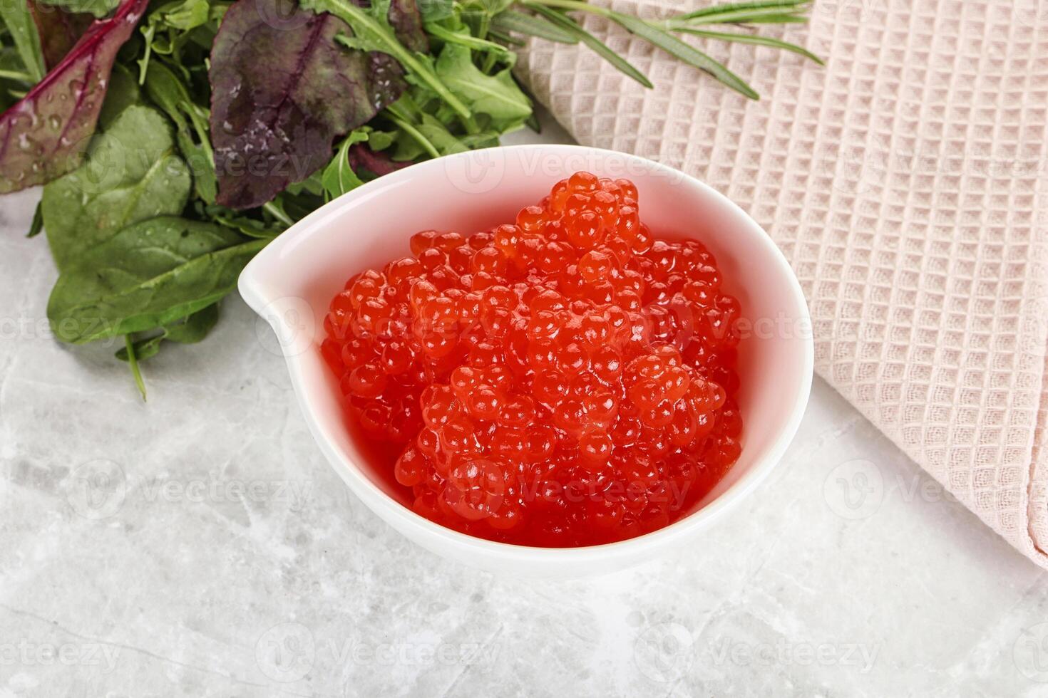 Red caviar in the bowl photo