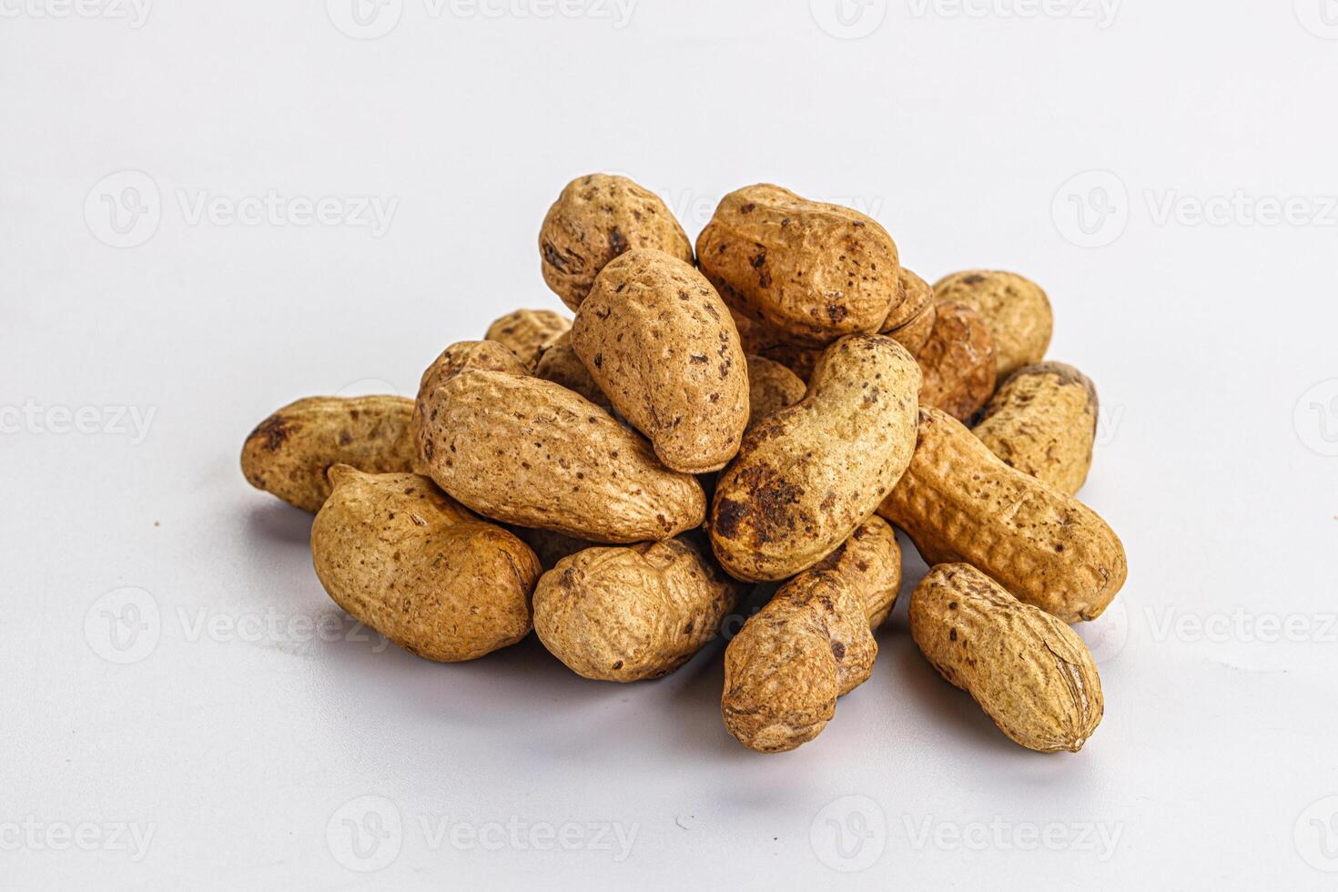Raw ripe unpeeled peanut heap photo