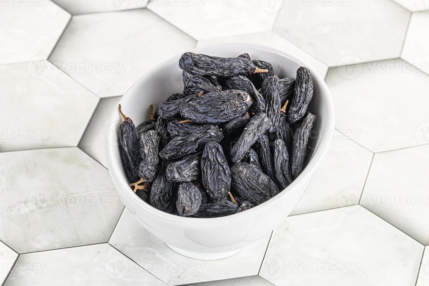 Blue raisin - dry grape berries photo