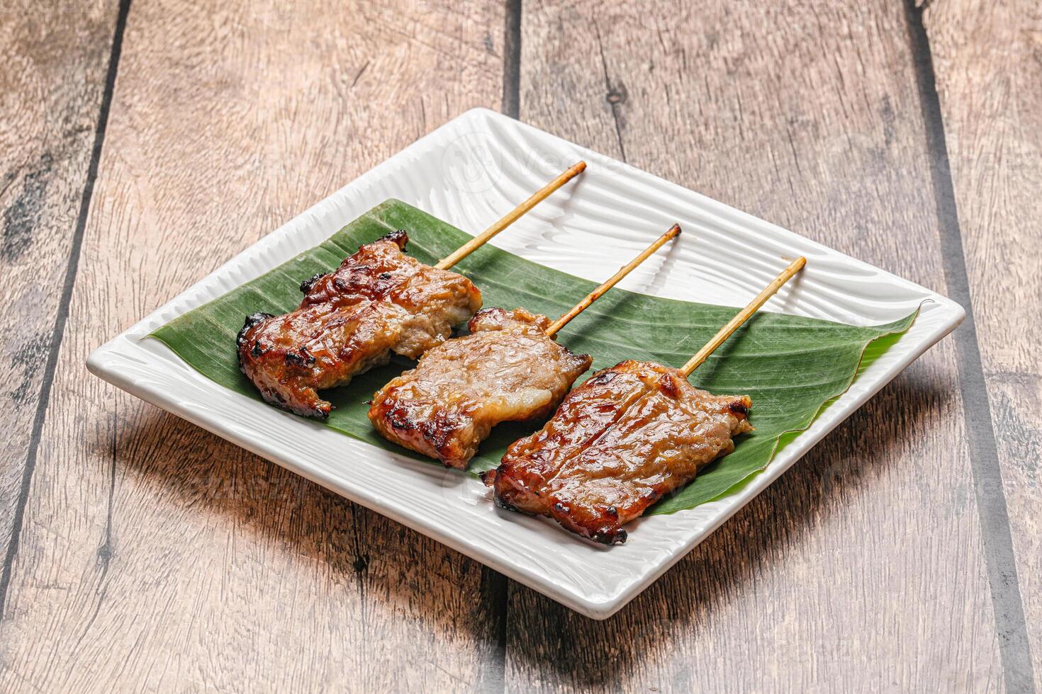 Thai cuisine - grilled pork skewer photo