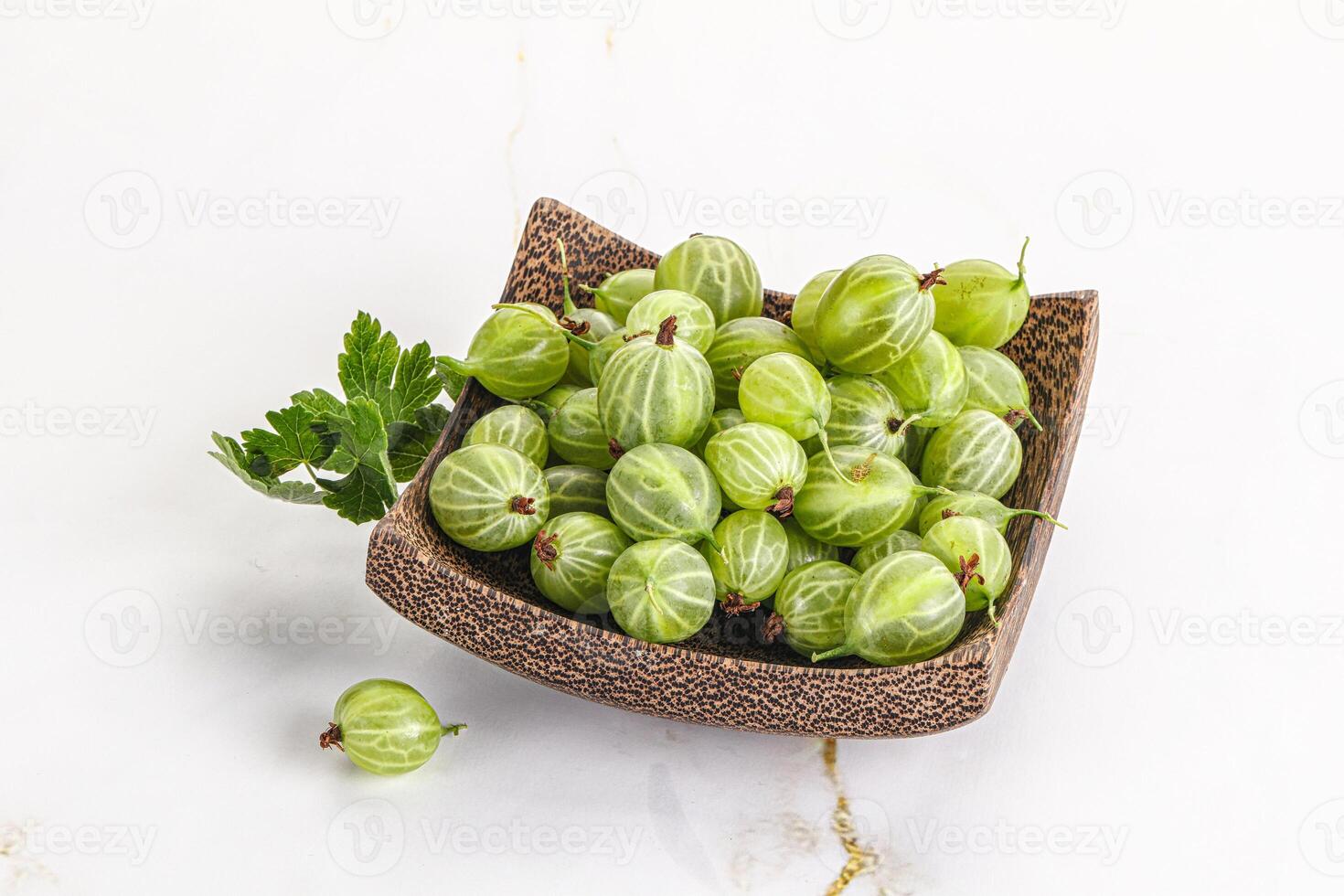 Sweet ripe gooseberries in the bowl photo