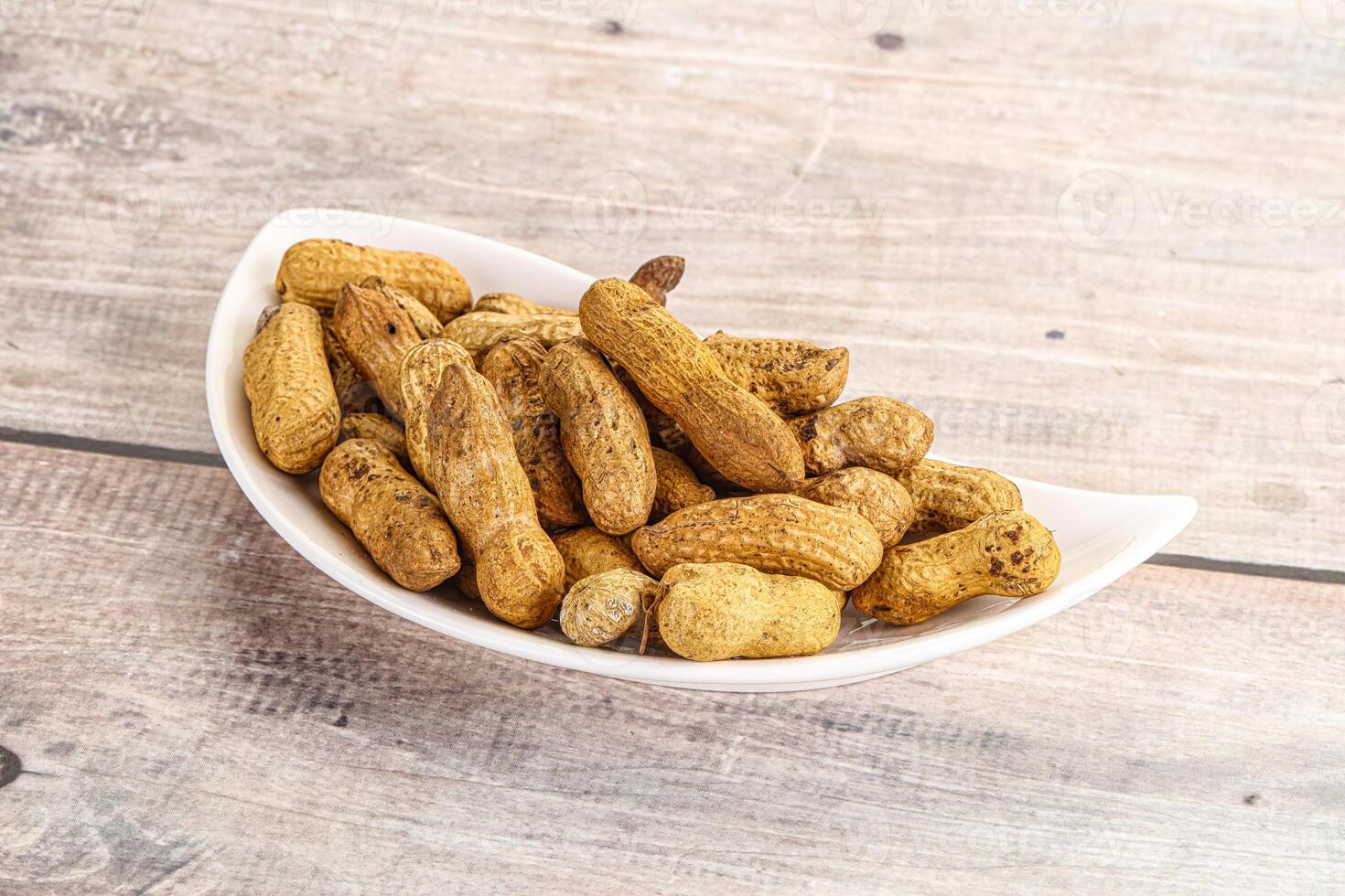 Raw ripe unpeeled peanut heap photo