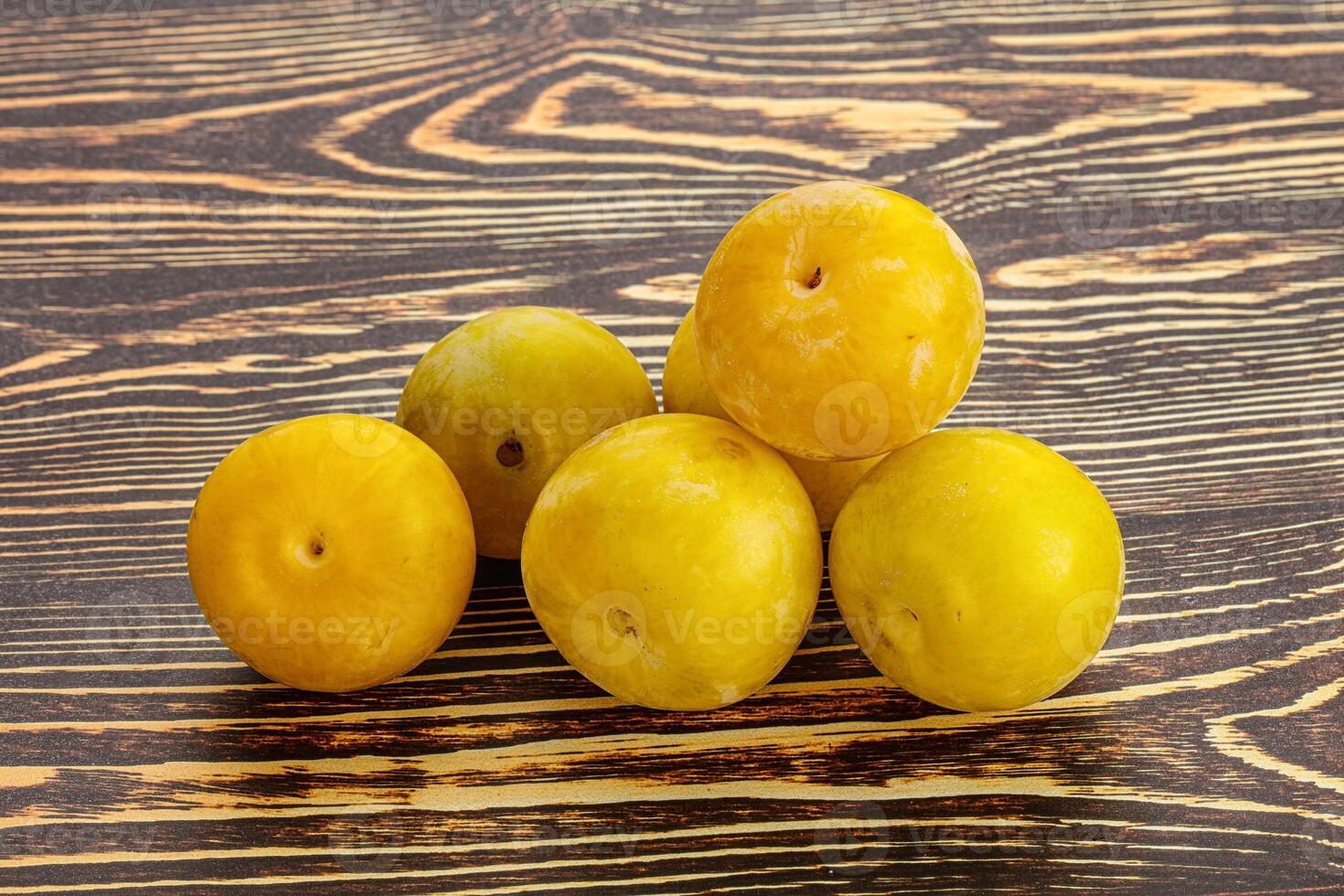 Yellow sweet plum heap fruit photo