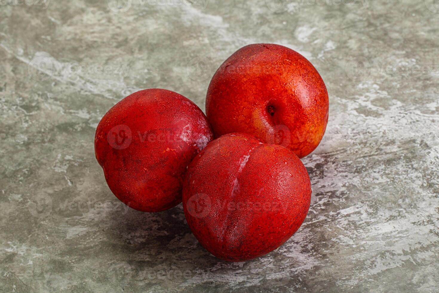 Ripe sweet juicy red plum photo