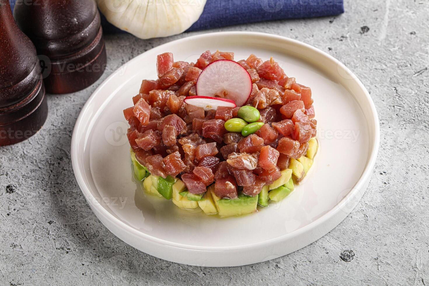 Tuna tartar with avocado and sauce photo