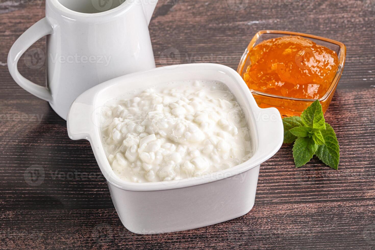 Grain curd with cream and jam photo