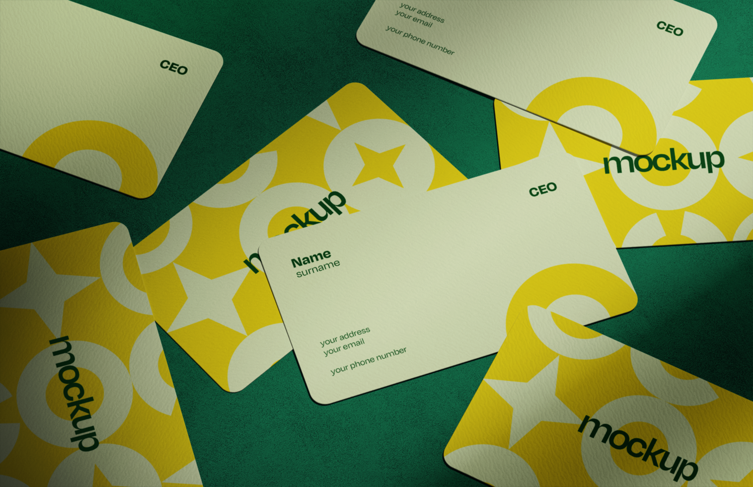 Collection of Rounded Corner Business Cards on Textured Surface psd