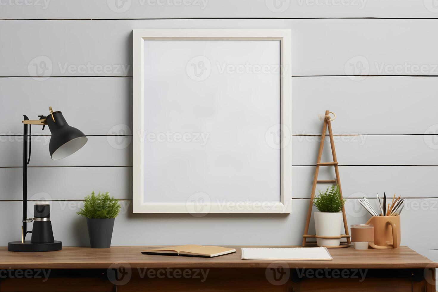 Empty photo frame mockup on wooden desk, table. Artwork template in interior design. Minimal home interior. Vase with flowers.