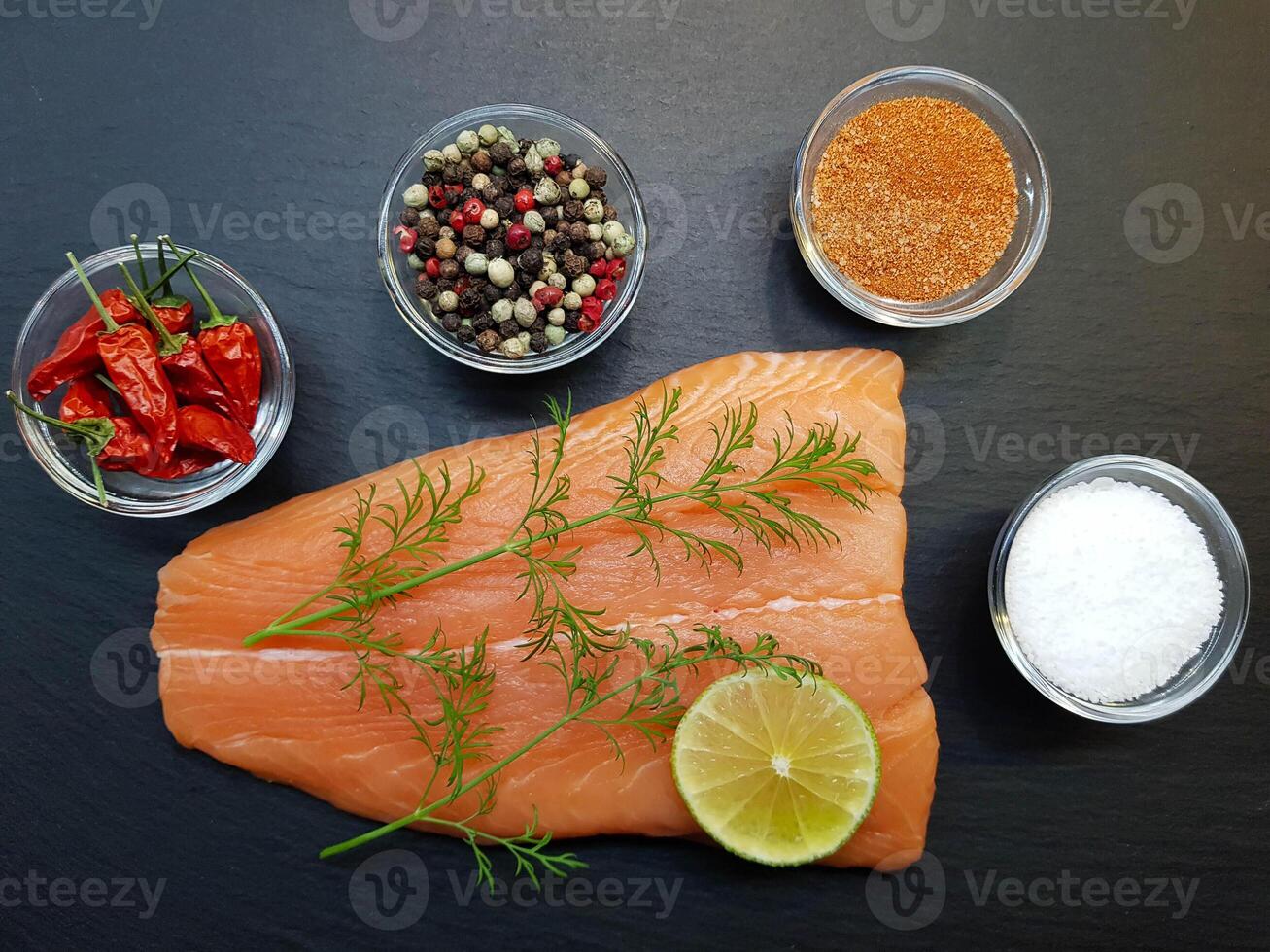 Fresh Salmon filet with herbs and spices photo