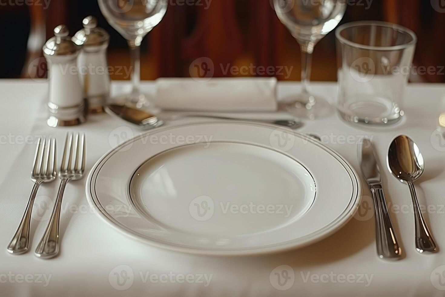 a dinner plate and cutlery for a wedding at a luxury hotel advertising food photography photo