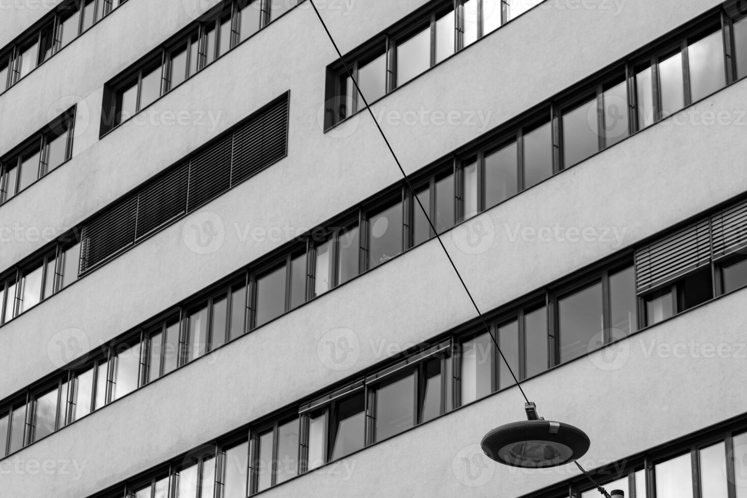 a modern building with a lamp photo