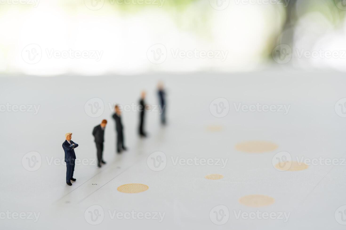 Group of miniature people businessman stands on graph to analyze data. Business and financial. photo