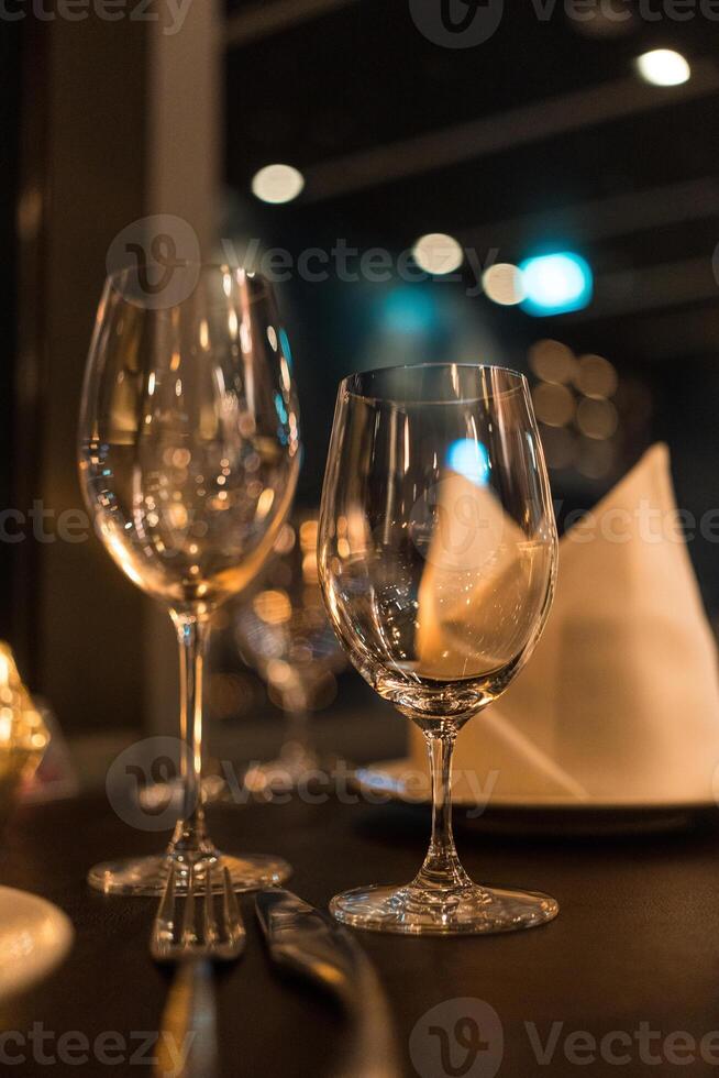 Two wine glasses in the luxury restaurant, beautiful evening restaurant photo