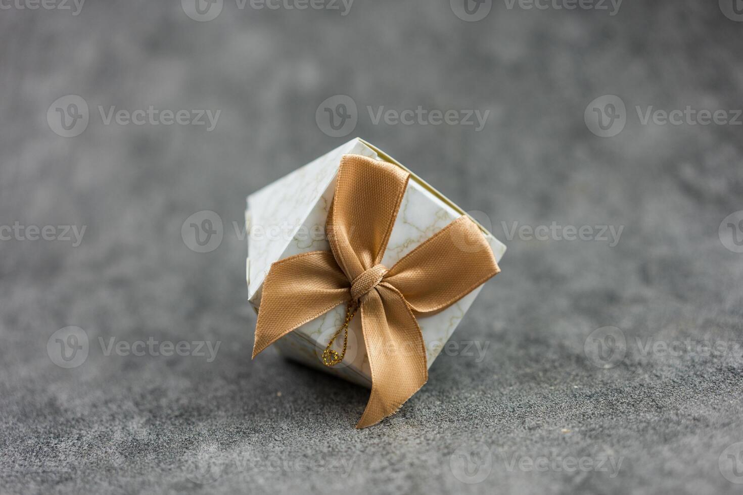Wedding favor, decorated with fabric and golden ribbon, for guest gifts at various events. photo