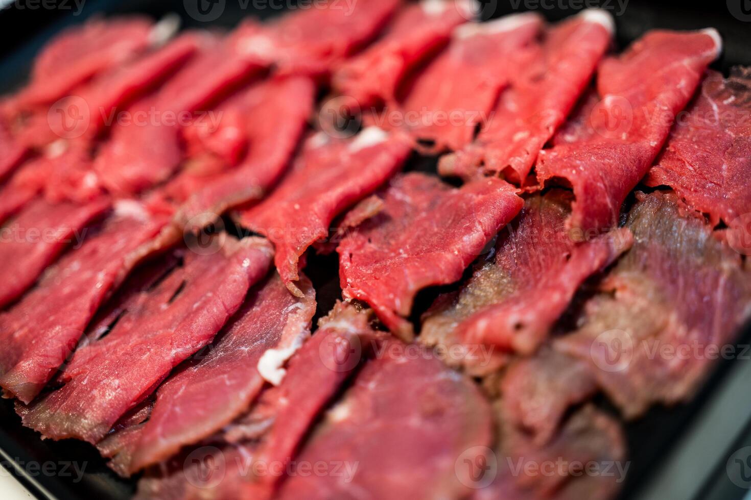 Sliced raw beef meat for hot pot photo