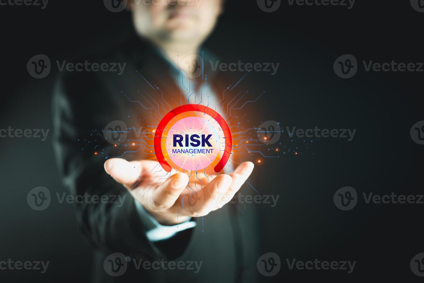 Businessman holding virtual risk management as strategy to avoid data loss photo