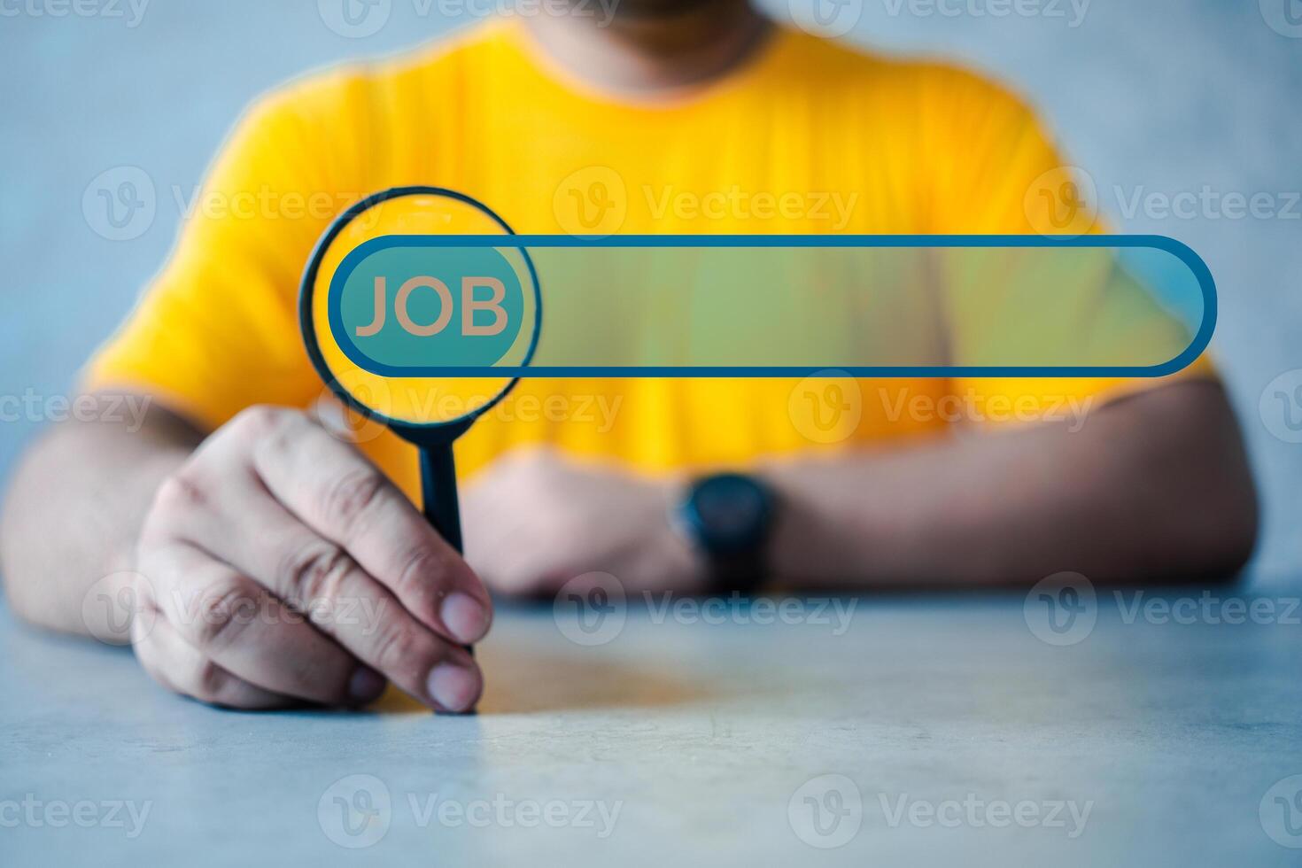 Man hold magnifying glass to find information on the internet online, job searching. photo