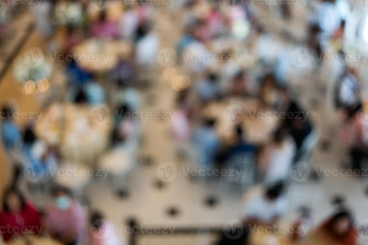 Blurry background many of people in wedding celebration at hotel ballroom photo