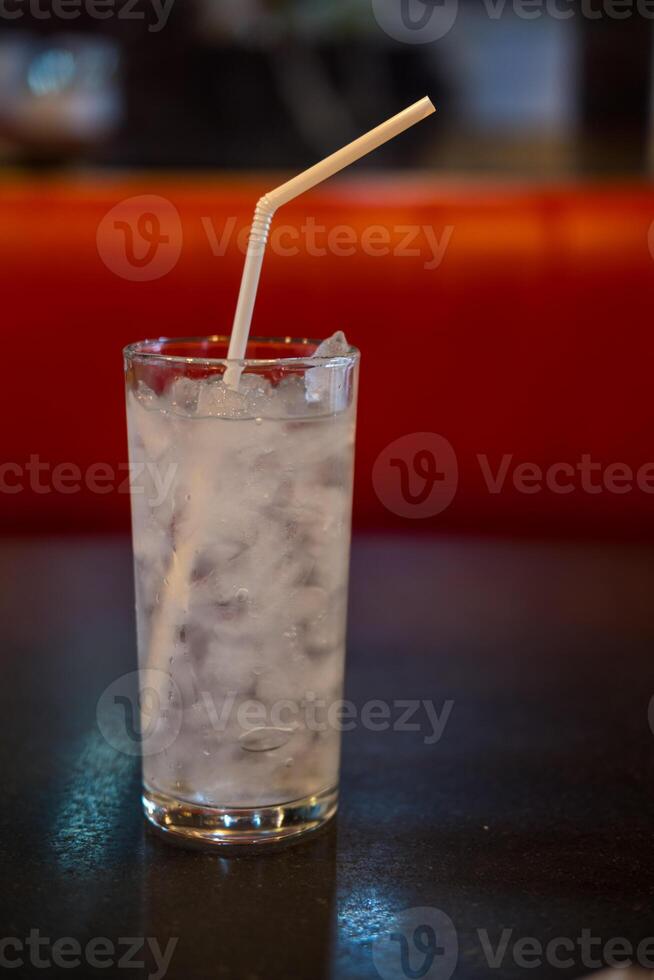 Glass of ice and water photo