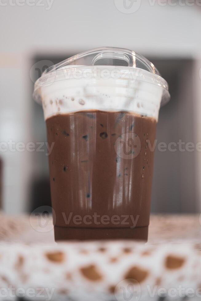 A glass of iced coffee mocha in clear glass photo