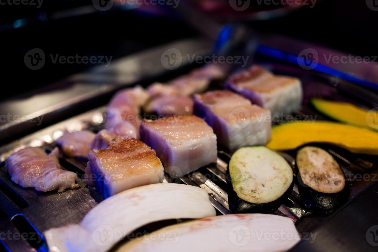 Korean BBQ, pork belly and vegetable on grilling pan photo