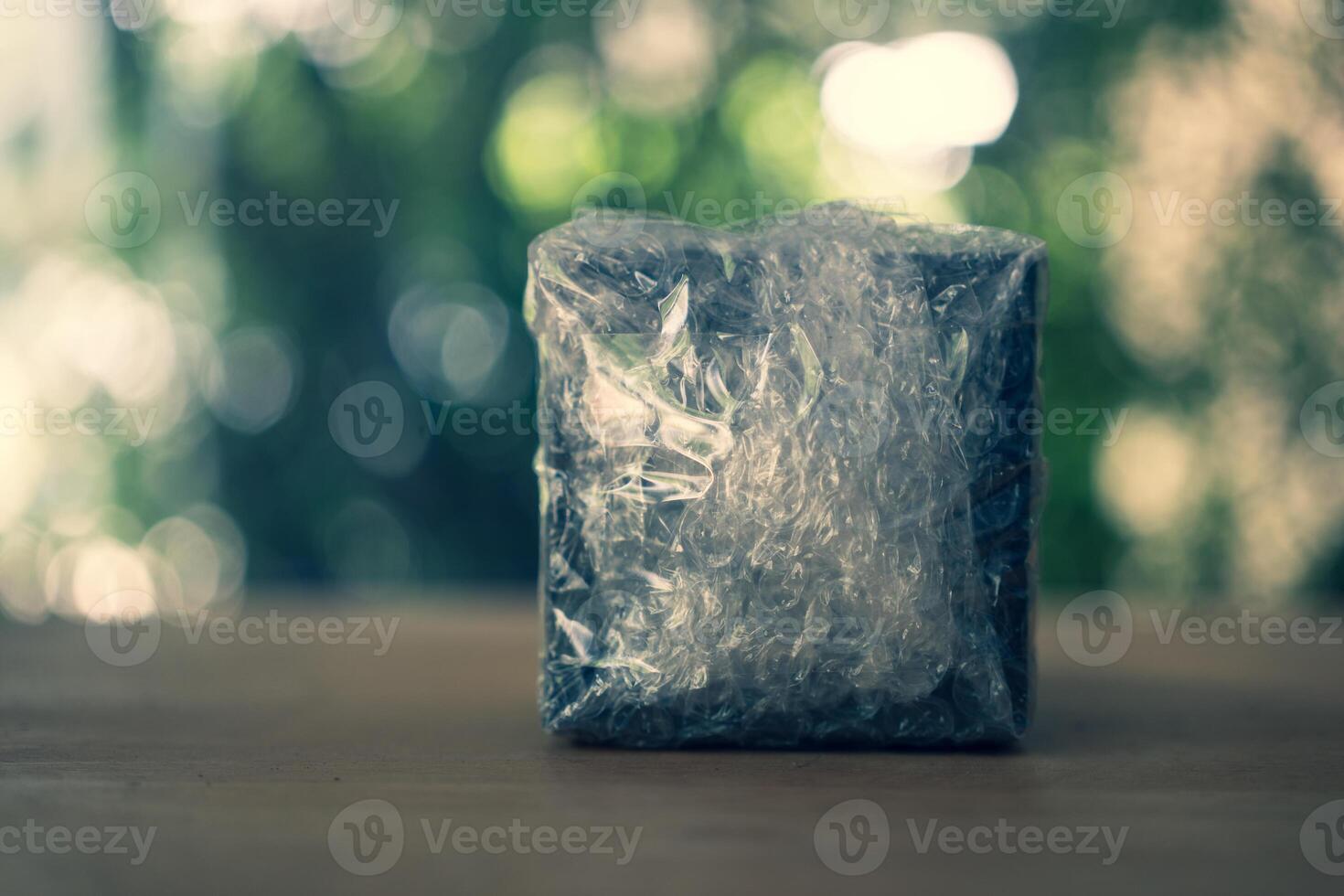 Parcel covered with bubble wrap along photo