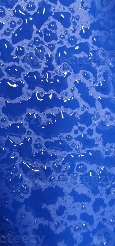 texture of water drops on blue background. abstractionism photo