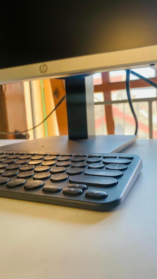 Keyboard pc and monitor in the white table photo