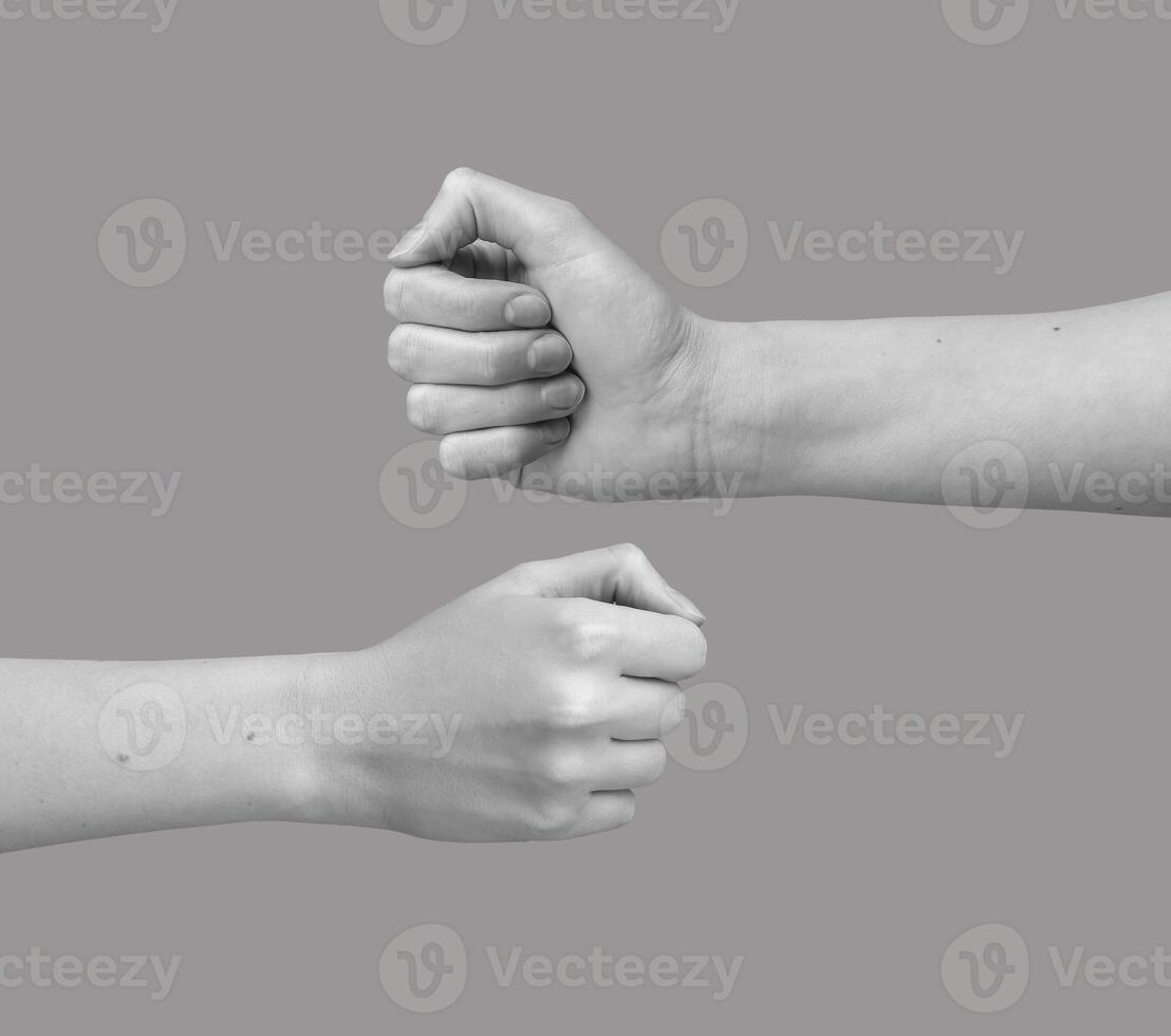 Two hands in fist bump gesture, bro greeting symbolizing team power, friendship. Female and male photo