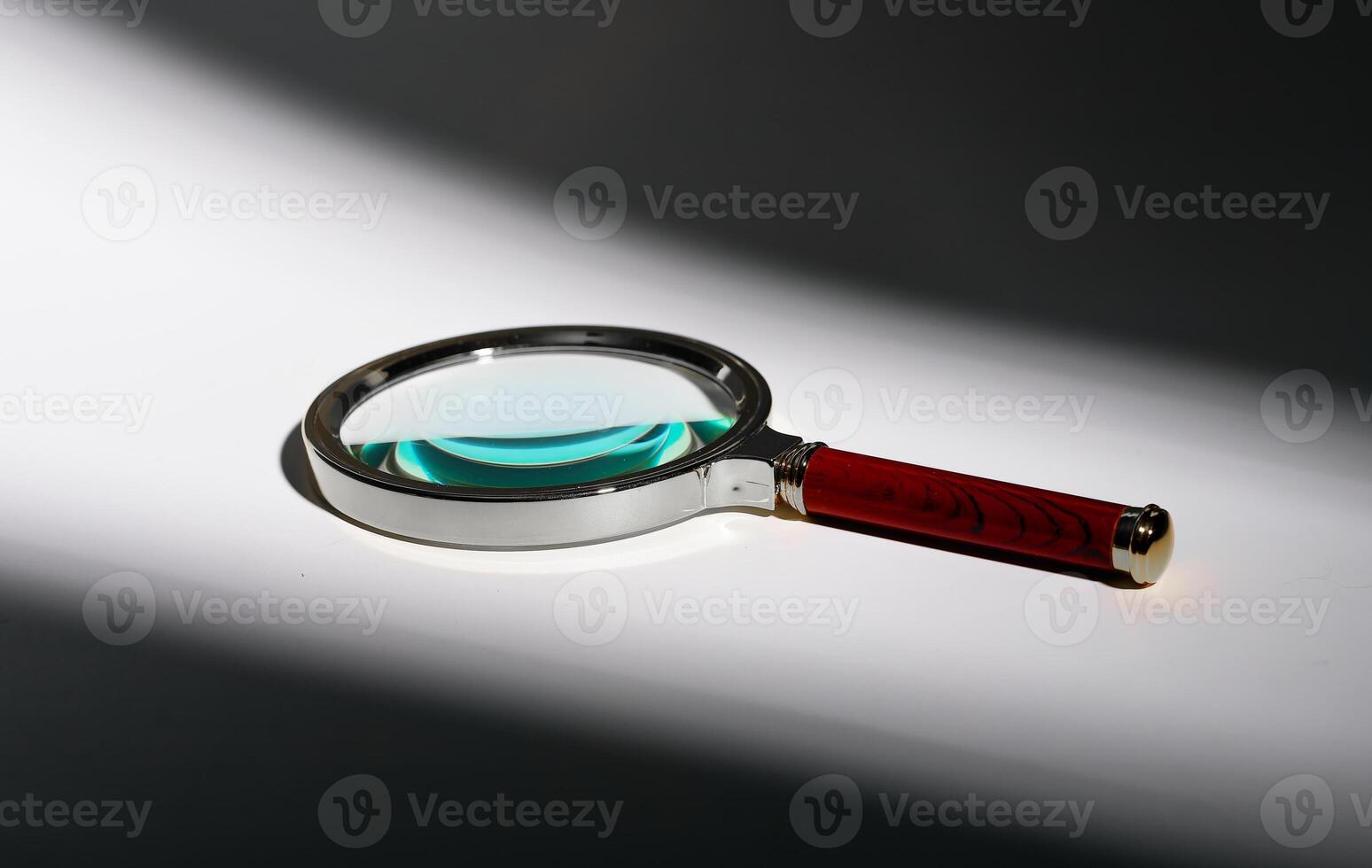 Vintage magnifying glass on shadow background. Minimal retro object, old glass lens. Search, zoom, photo