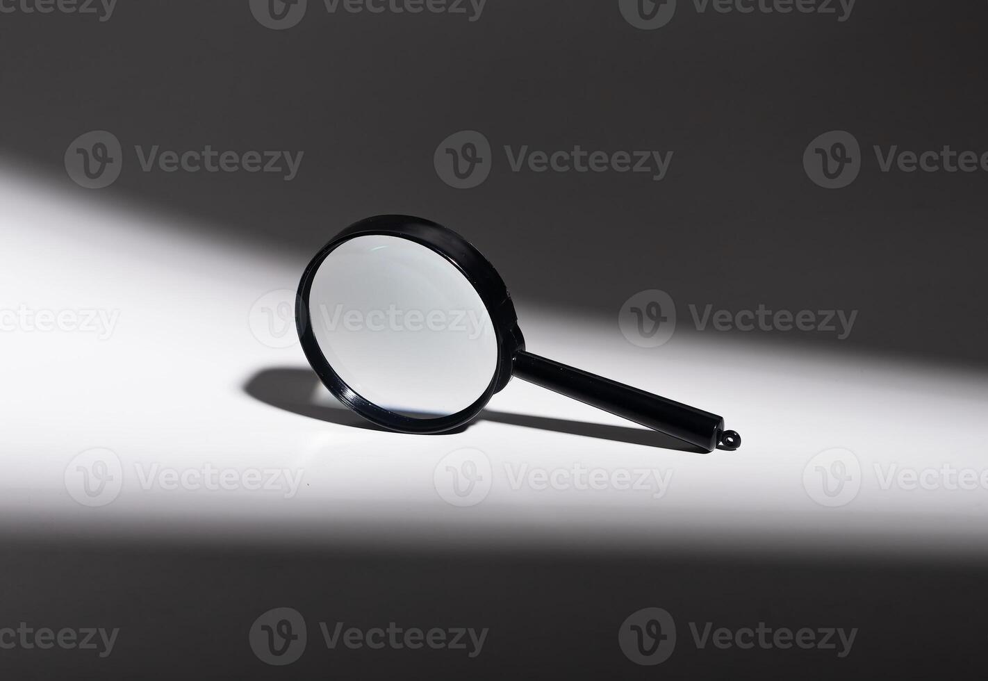 magnify glass. Conceptual science object, education tool. Minimal, abstract background. Control, photo