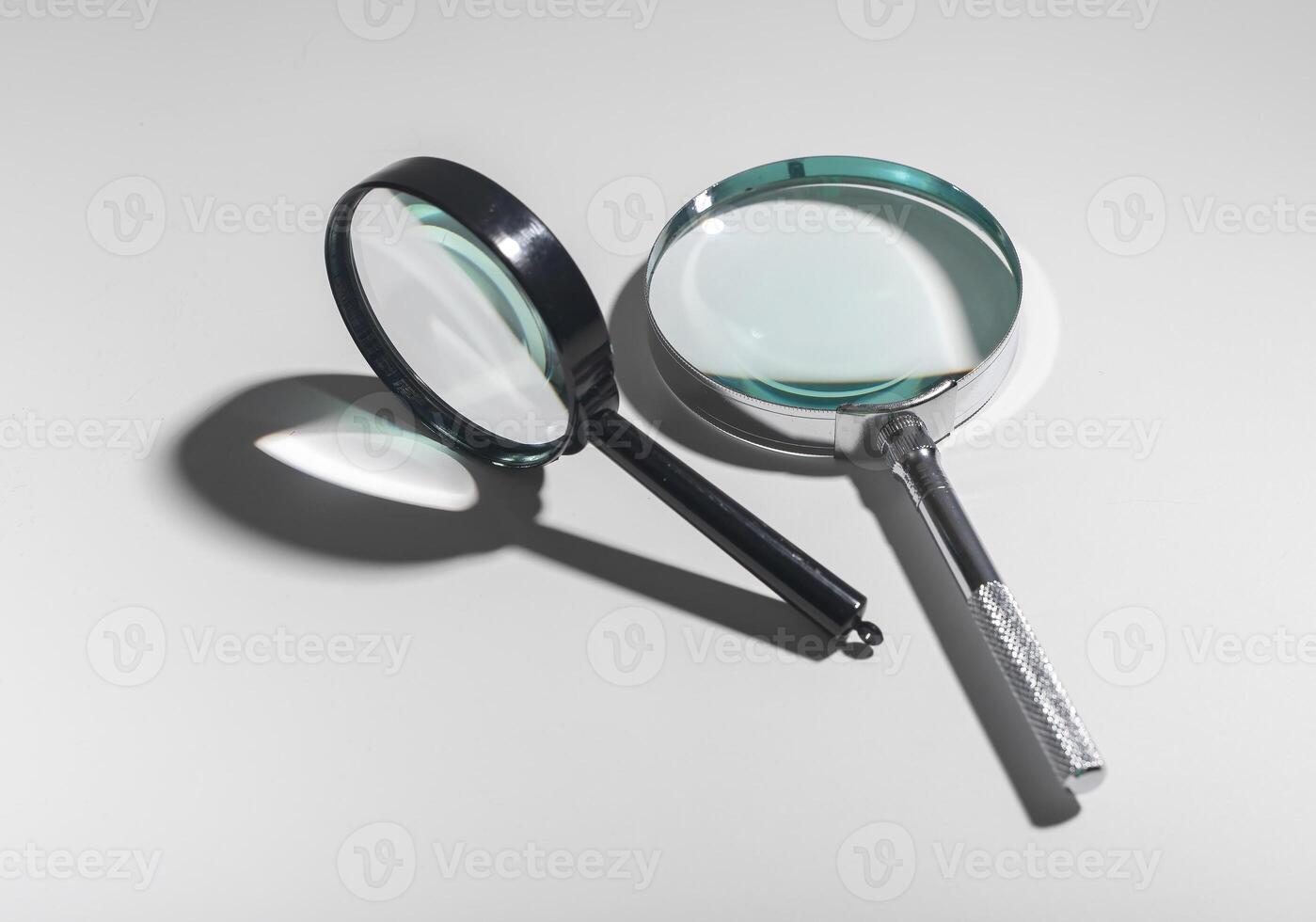 Magnifying glass concept for research and analysis. Transparent lens to focus and explore. Business photo