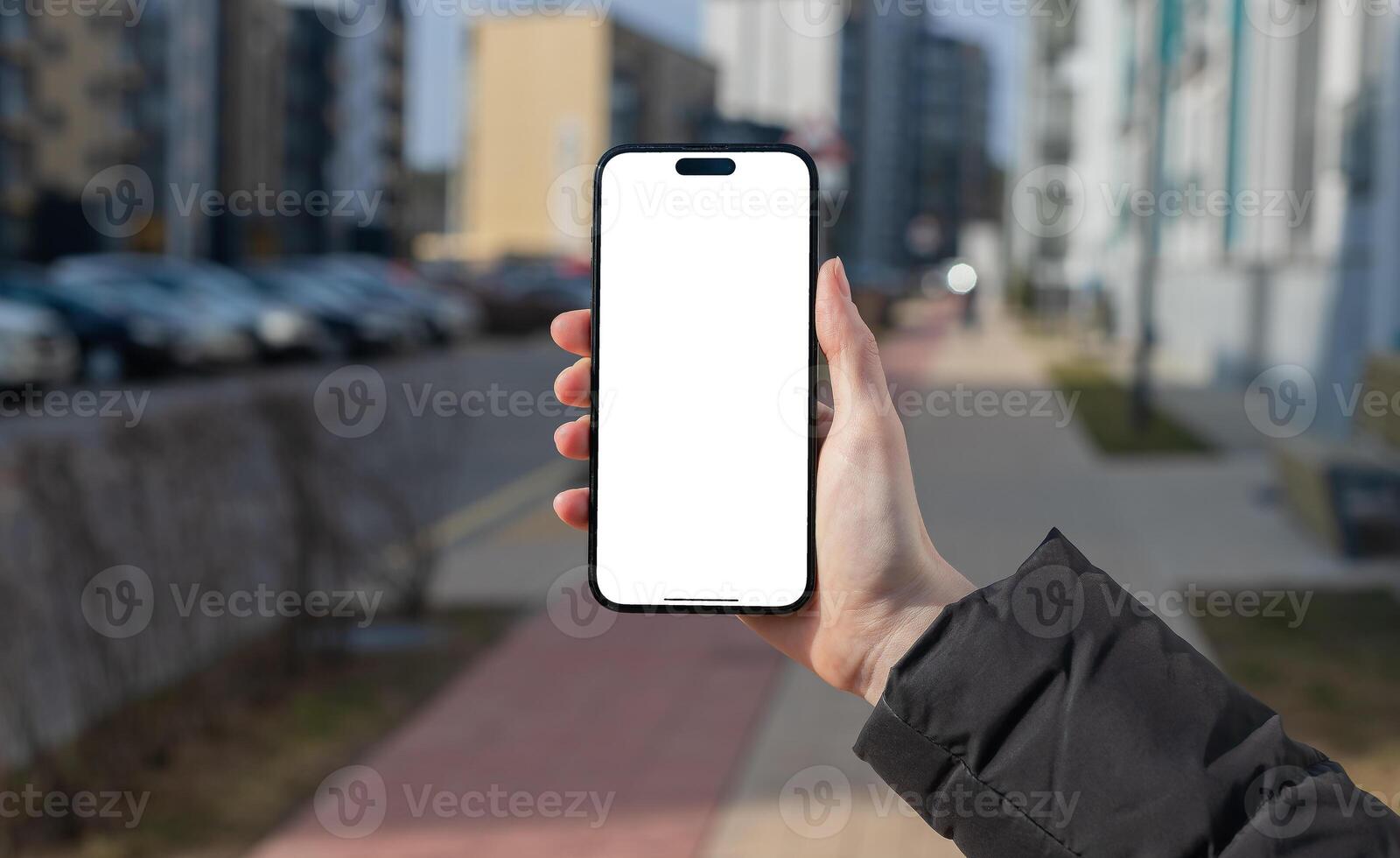 Berlin Germany January 21 2024 Person using smartphone in cityscape, holding mobile phone with photo