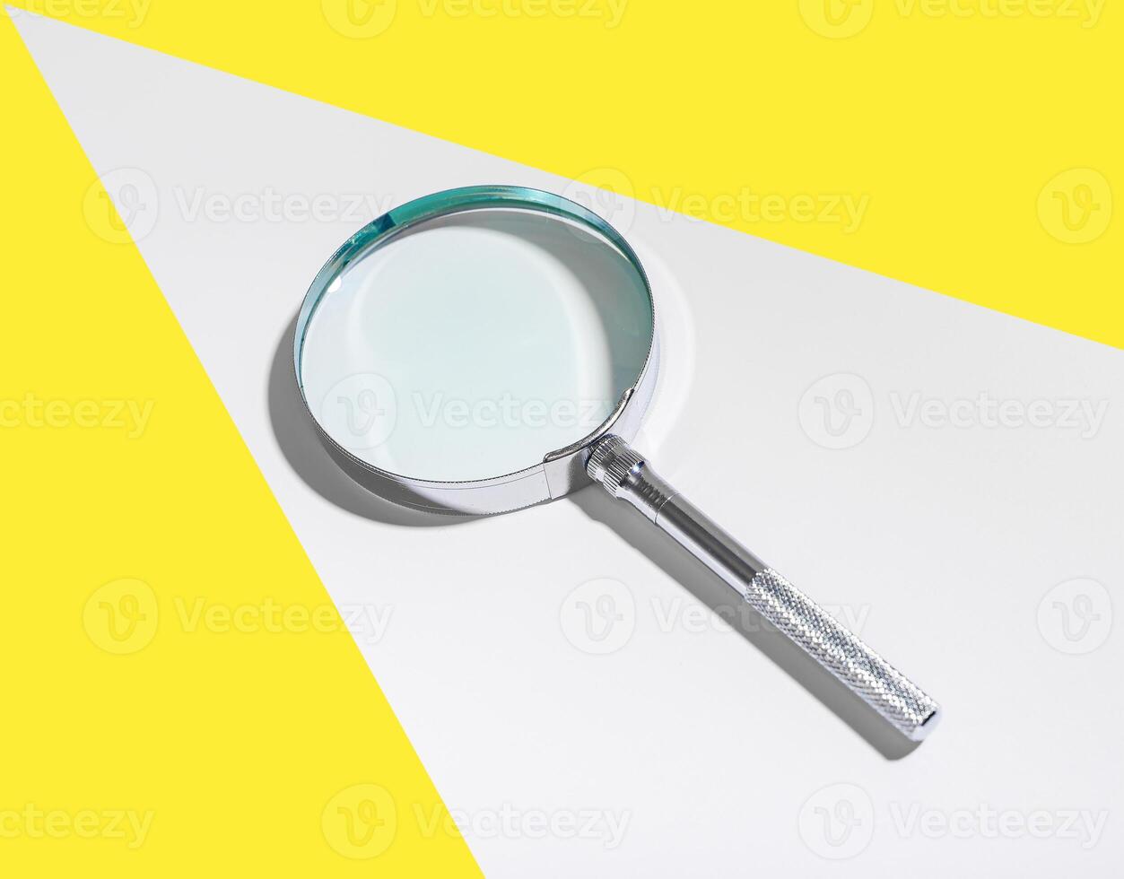 Search concept background with magnifying glass. Zoom in to examine objects, control and explore photo