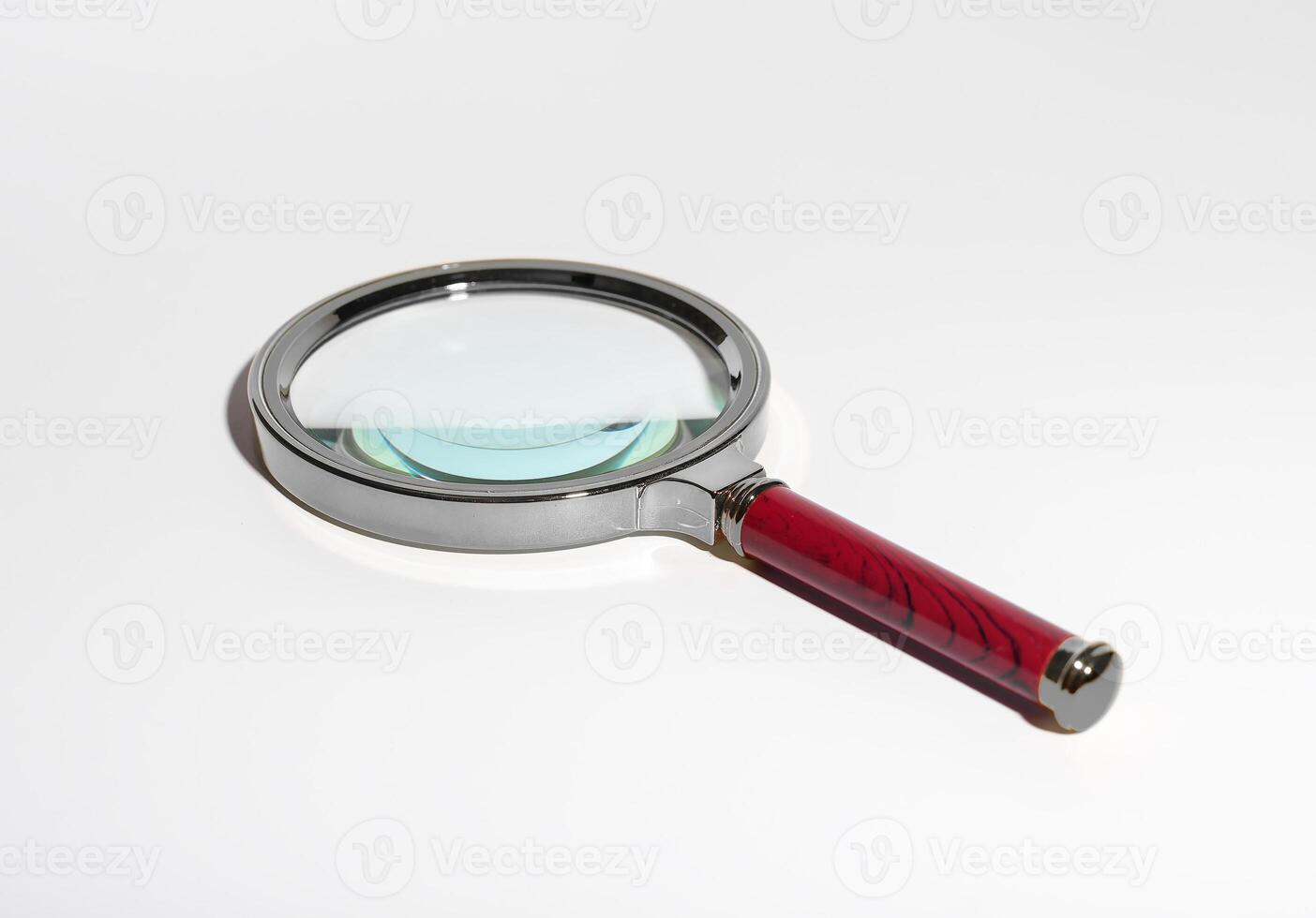 Magnifying glass tool for research and scrutiny. Transparent glass lens for detailed analysis. photo